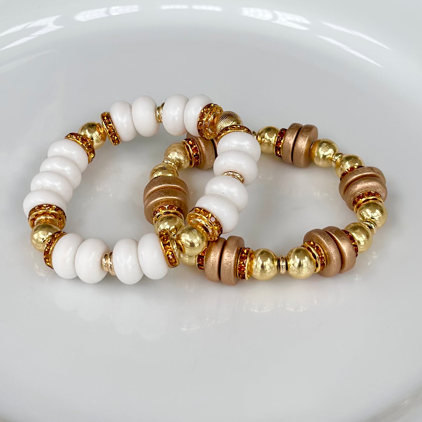 WHITE SPIRAL BANGLE WITH AMBER CZ ACCENTS