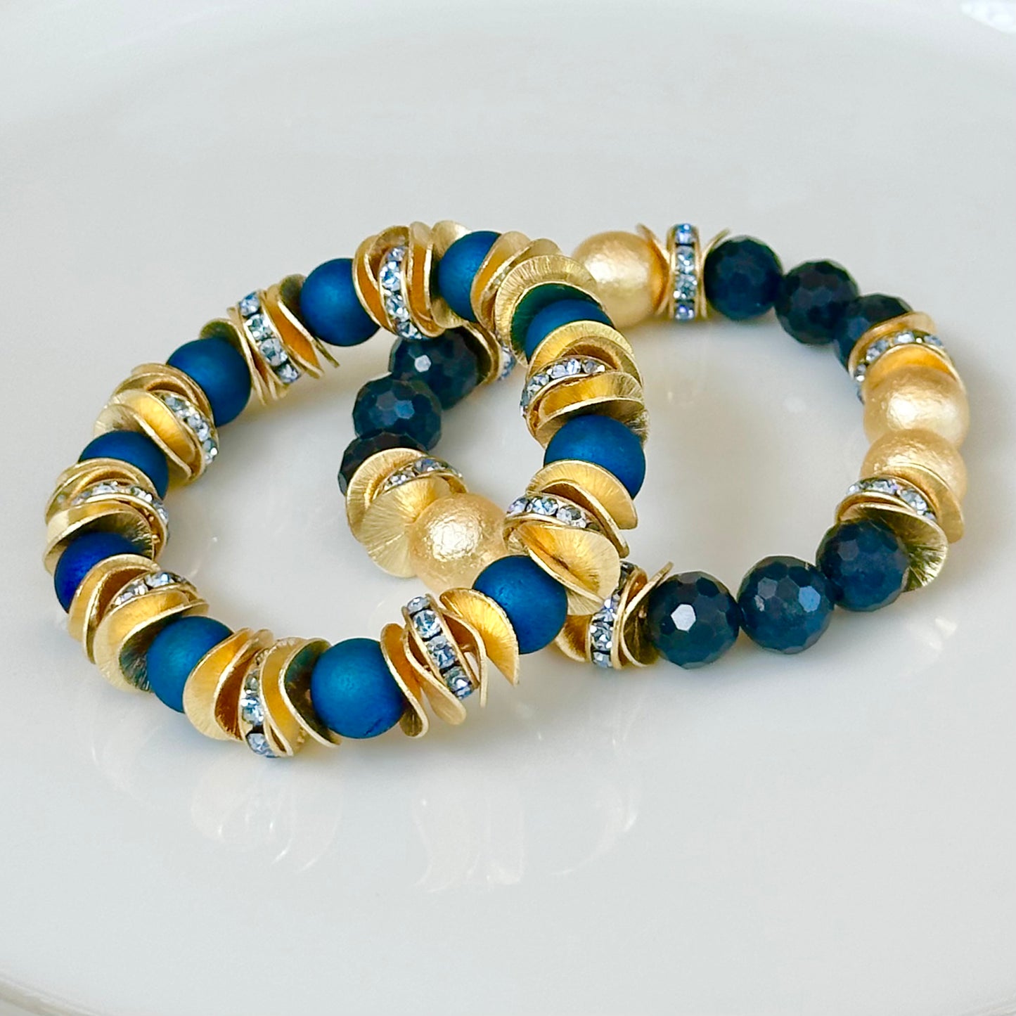 NAVY BLUE FACETED GEMSTONE, GOLD WAVY DISC BANGLE WITH GOLD AND CRYSTAL ACCENTS