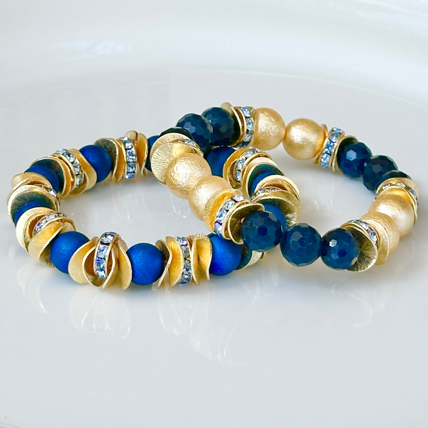 NAVY BLUE FACETED GEMSTONE, GOLD WAVY DISC BANGLE WITH GOLD AND CRYSTAL ACCENTS