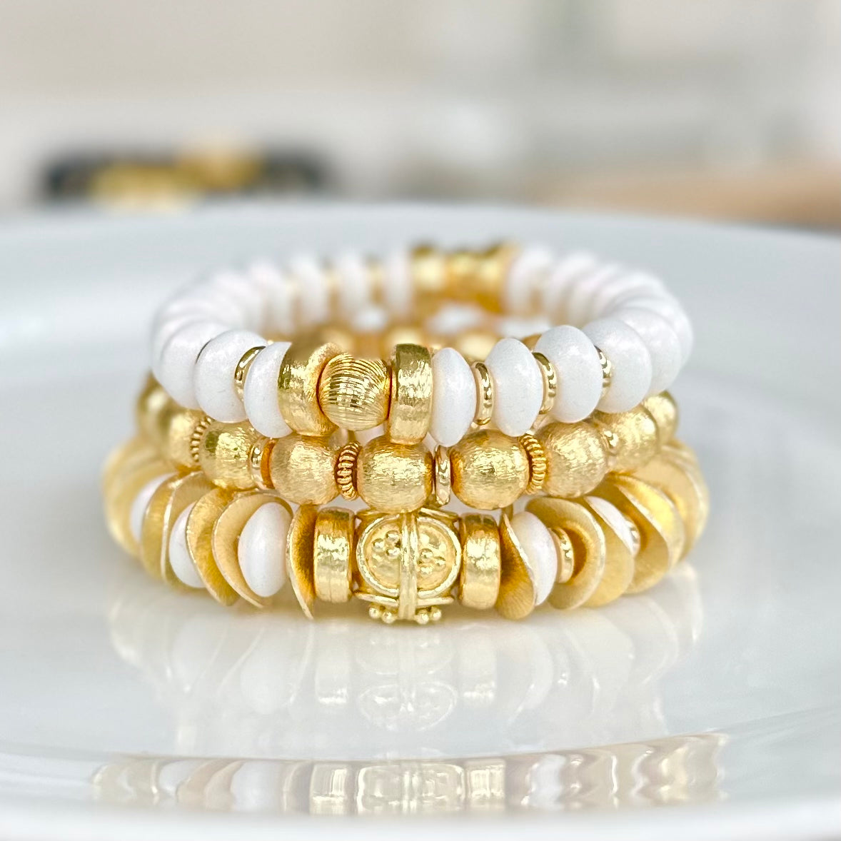 GOLD WAVY DISC AND WHITE STATEMENT BRACELET