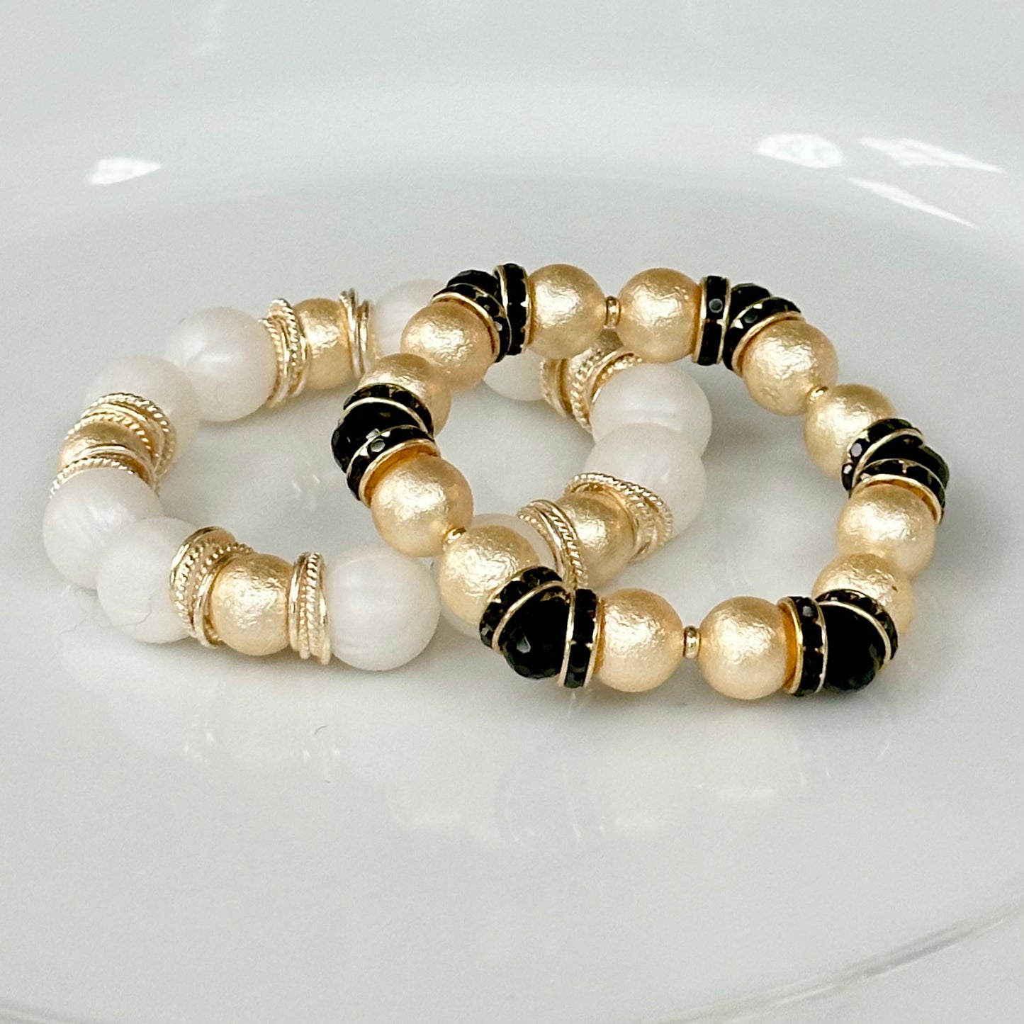 GOLD SHELL PEARL BANGLE WITH BLACK CRYSTAL ACCENTS