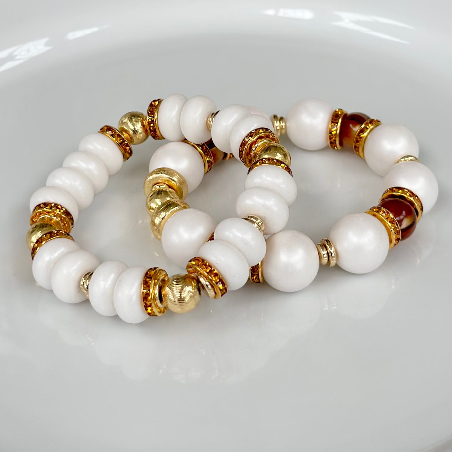 WHITE SPIRAL BANGLE WITH AMBER CZ ACCENTS
