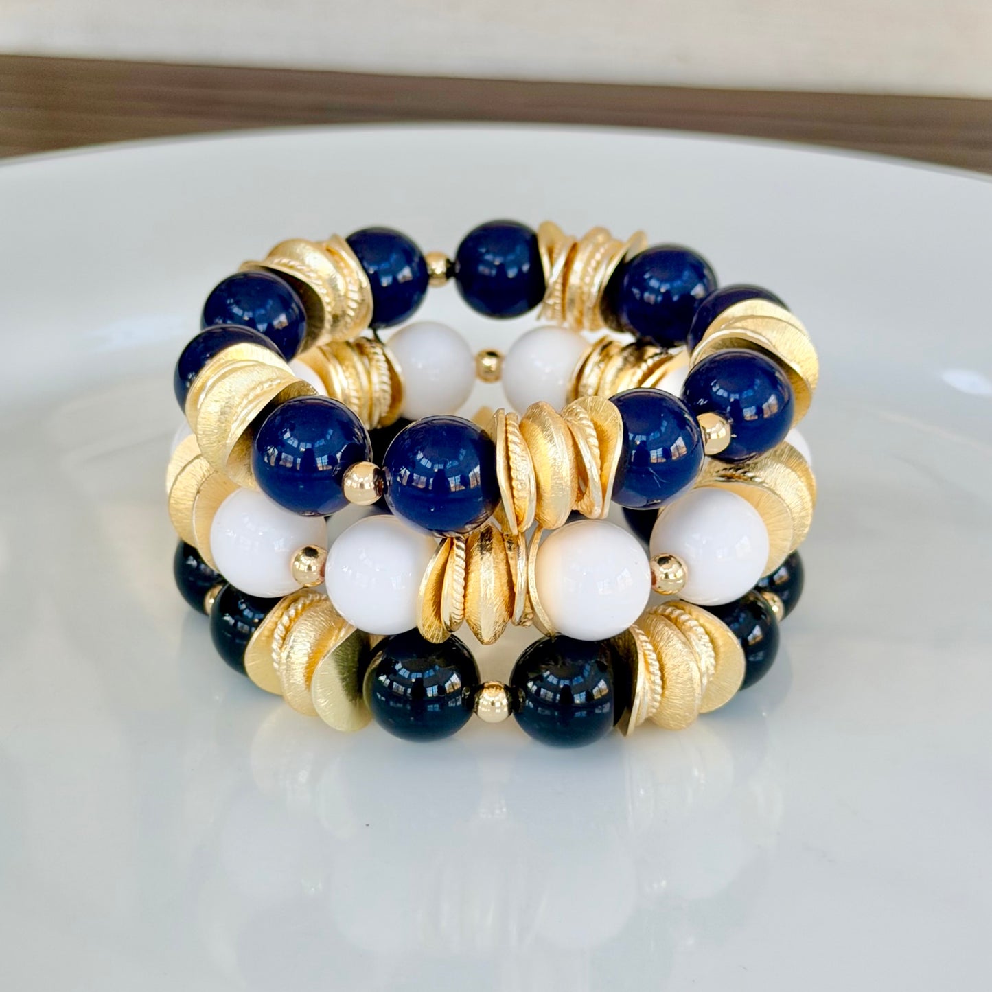 WHITE AND GOLD WAVY DISC BANGLE WITH BRUSHED GOLD ACCENTS