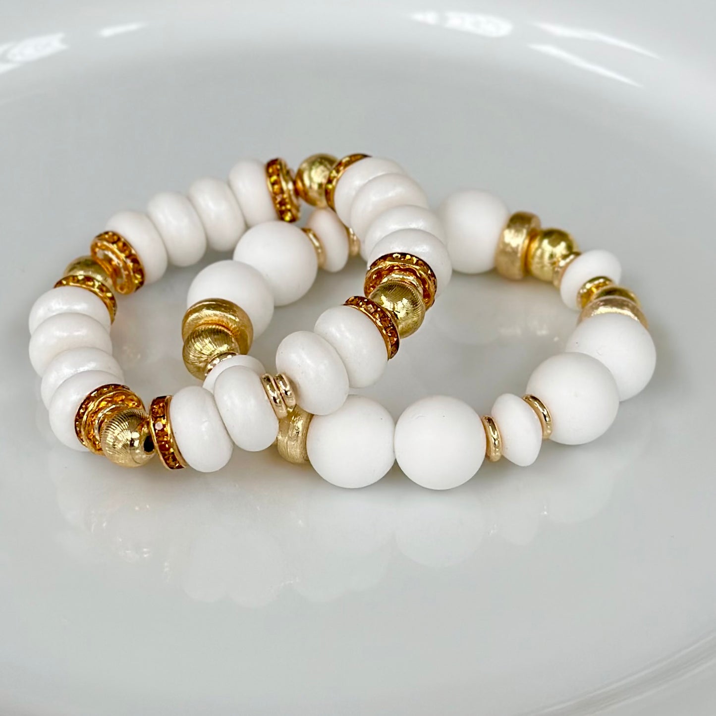 WHITE SPIRAL BANGLE WITH AMBER CZ ACCENTS