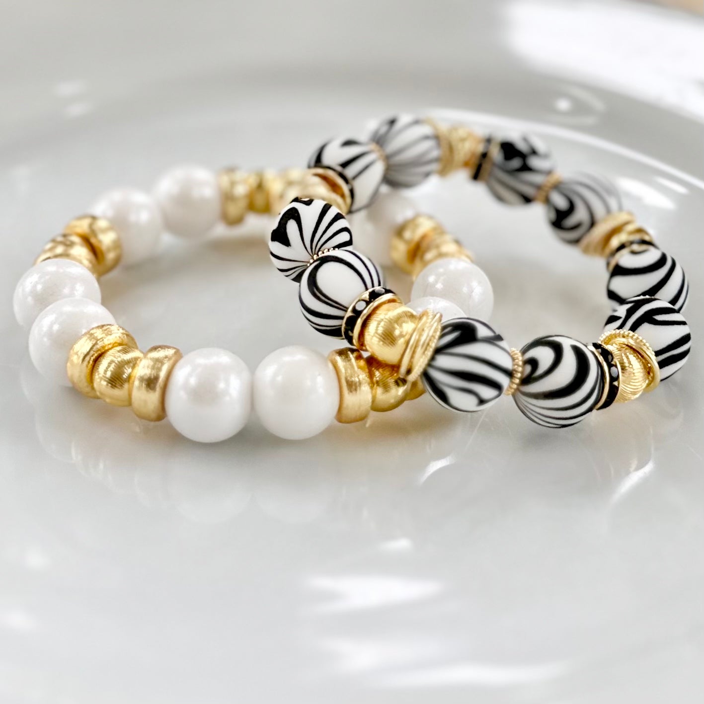BLACK AND WHITE ZEBRA BANGLE WITH GOLD ACCENTS