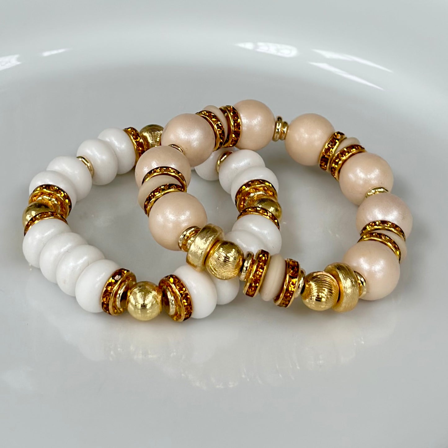 WHITE SPIRAL BANGLE WITH AMBER CZ ACCENTS
