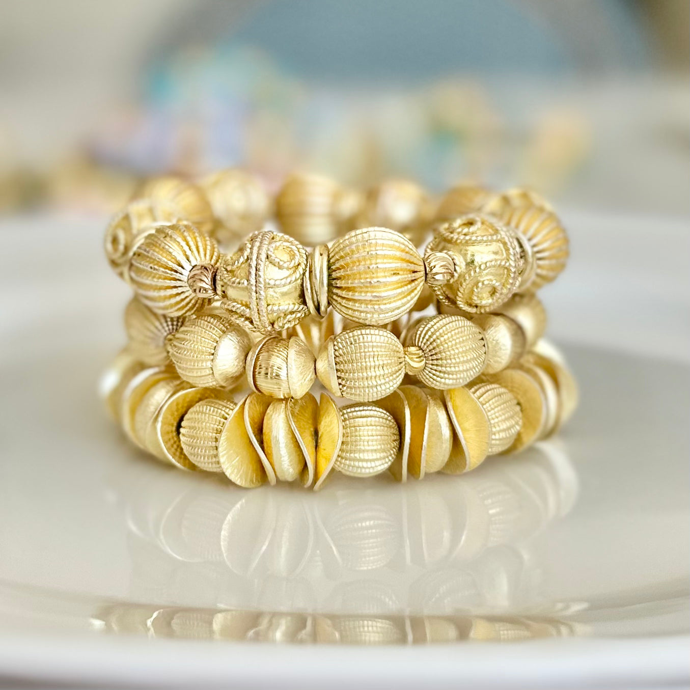 GOLD WAVY DISC AND CORRUGATED STATEMENT BRACELET