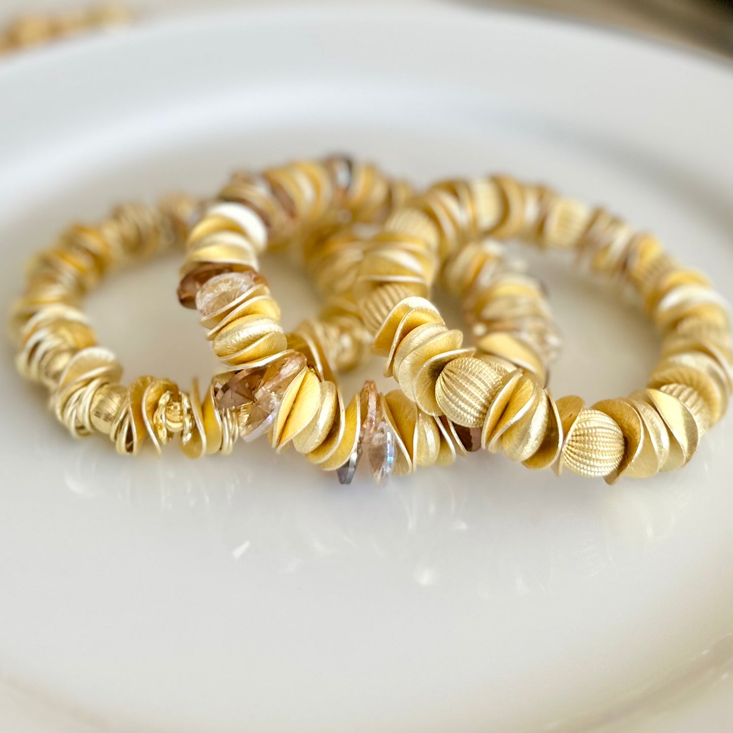 GOLD WAVY DISC STATEMENT BRACELET