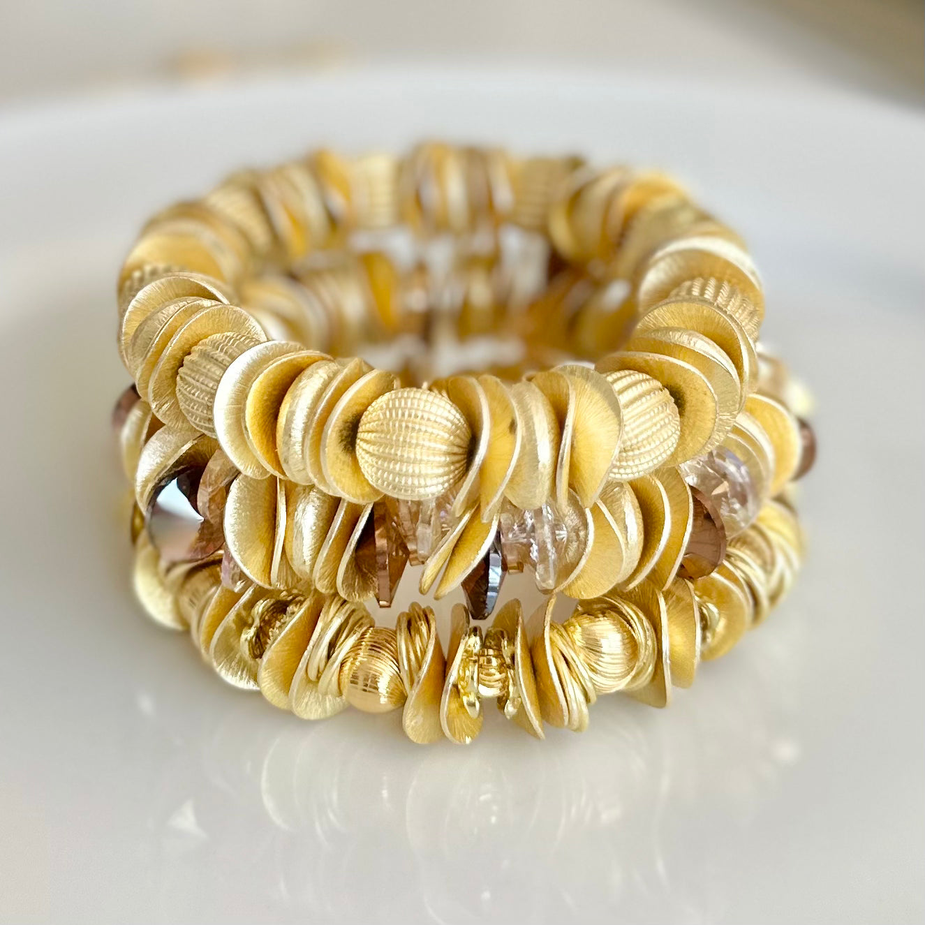 GOLD WAVY DISC AND CORRUGATED STATEMENT BRACELET