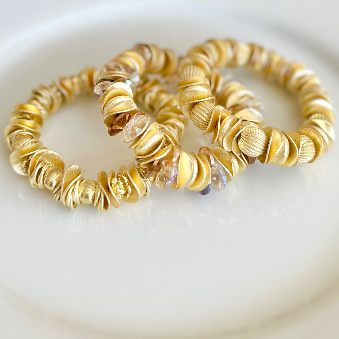 GOLD WAVY DISC STATEMENT BRACELET