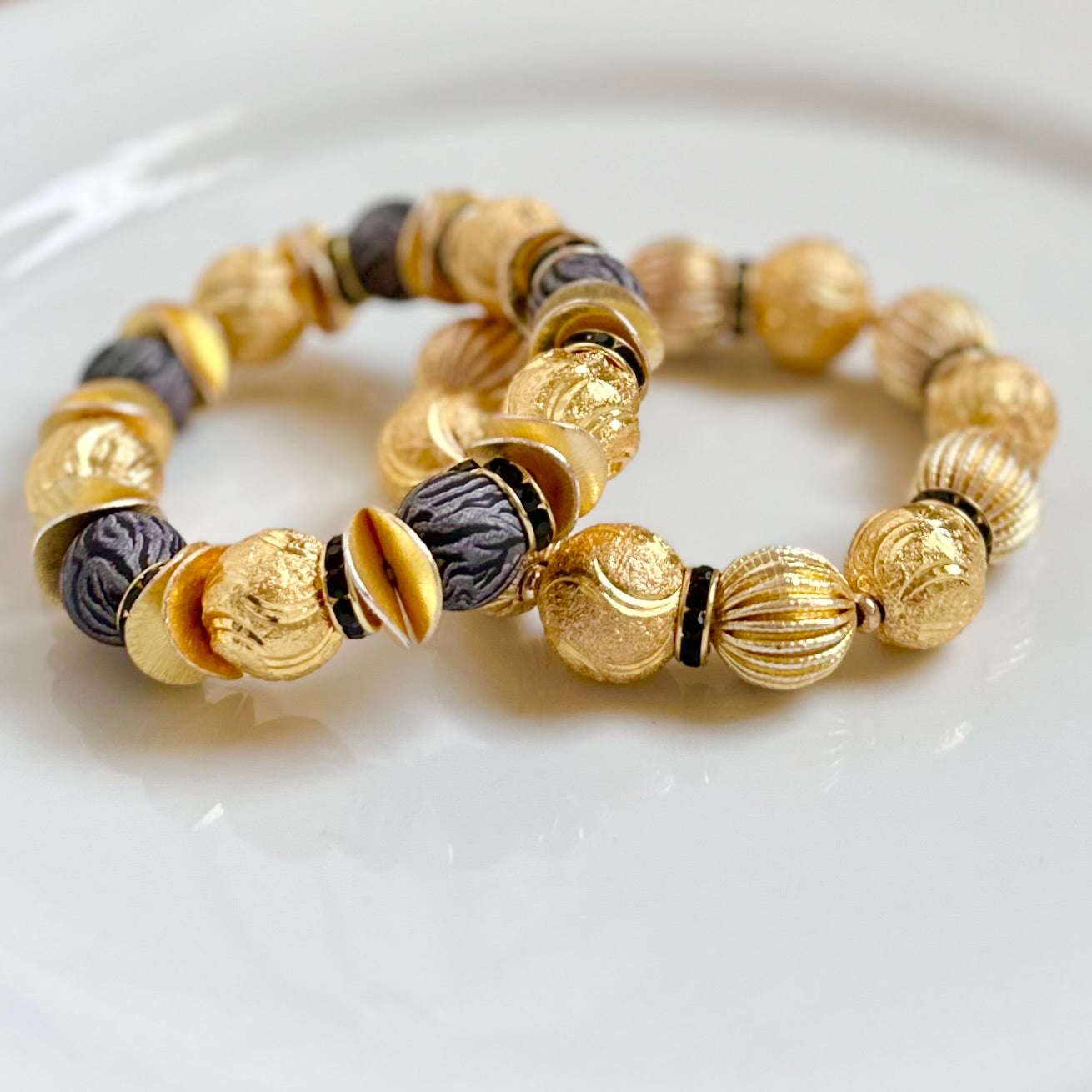 RIBBED AND TEXTURED GOLD STATEMENT BRACELET WITH BLACK ACCENTS