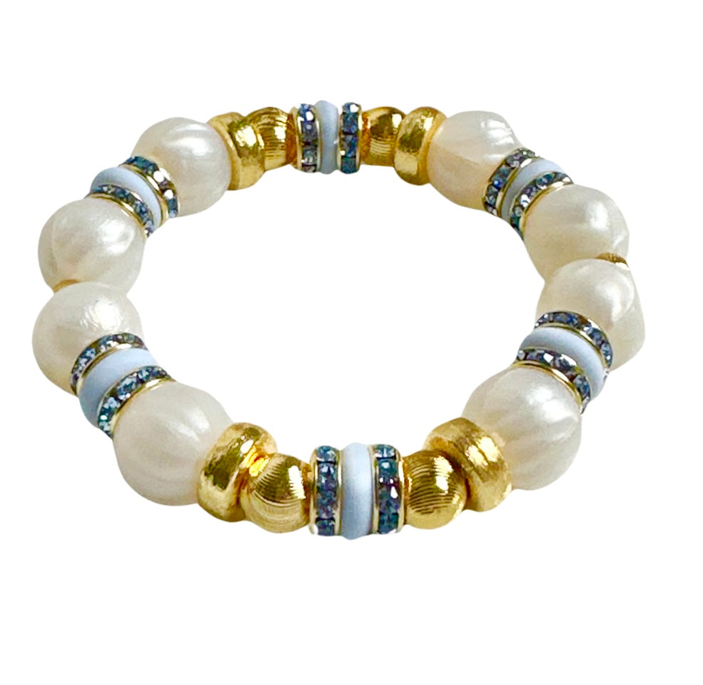 PEARLIZED IVORY BANGLE WITH LIGHT BLUE AND CZ ACCENTS
