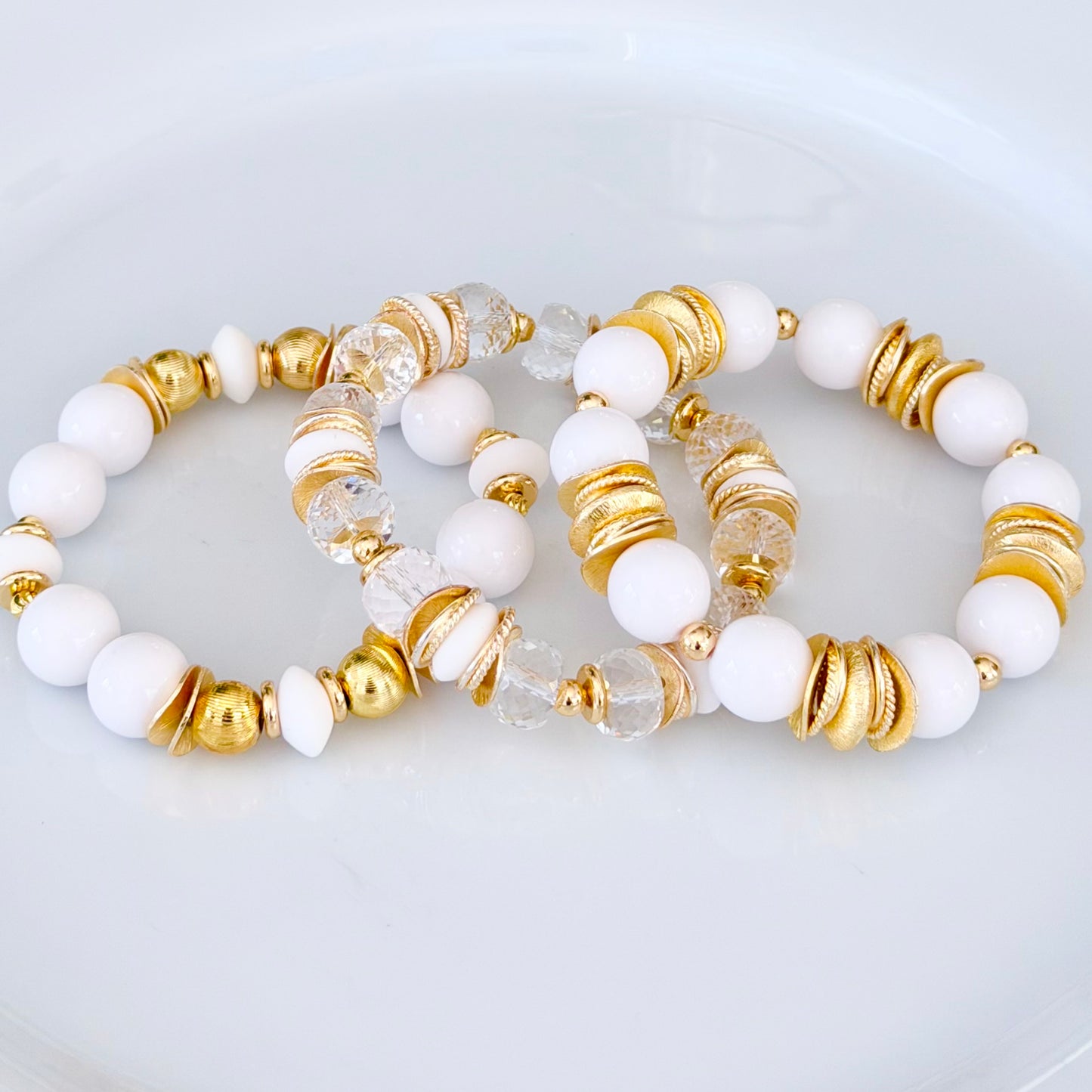 FACETED LUCITE BANGLE WITH GOLD, WAVY DISC AND WHITE ACCENTS