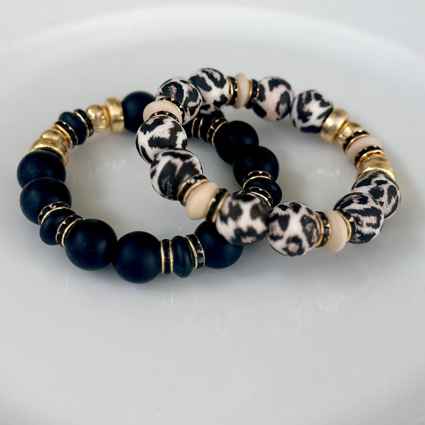 BLACK BANGLE WITH GOLD AND BLACK CZ ACCENTS