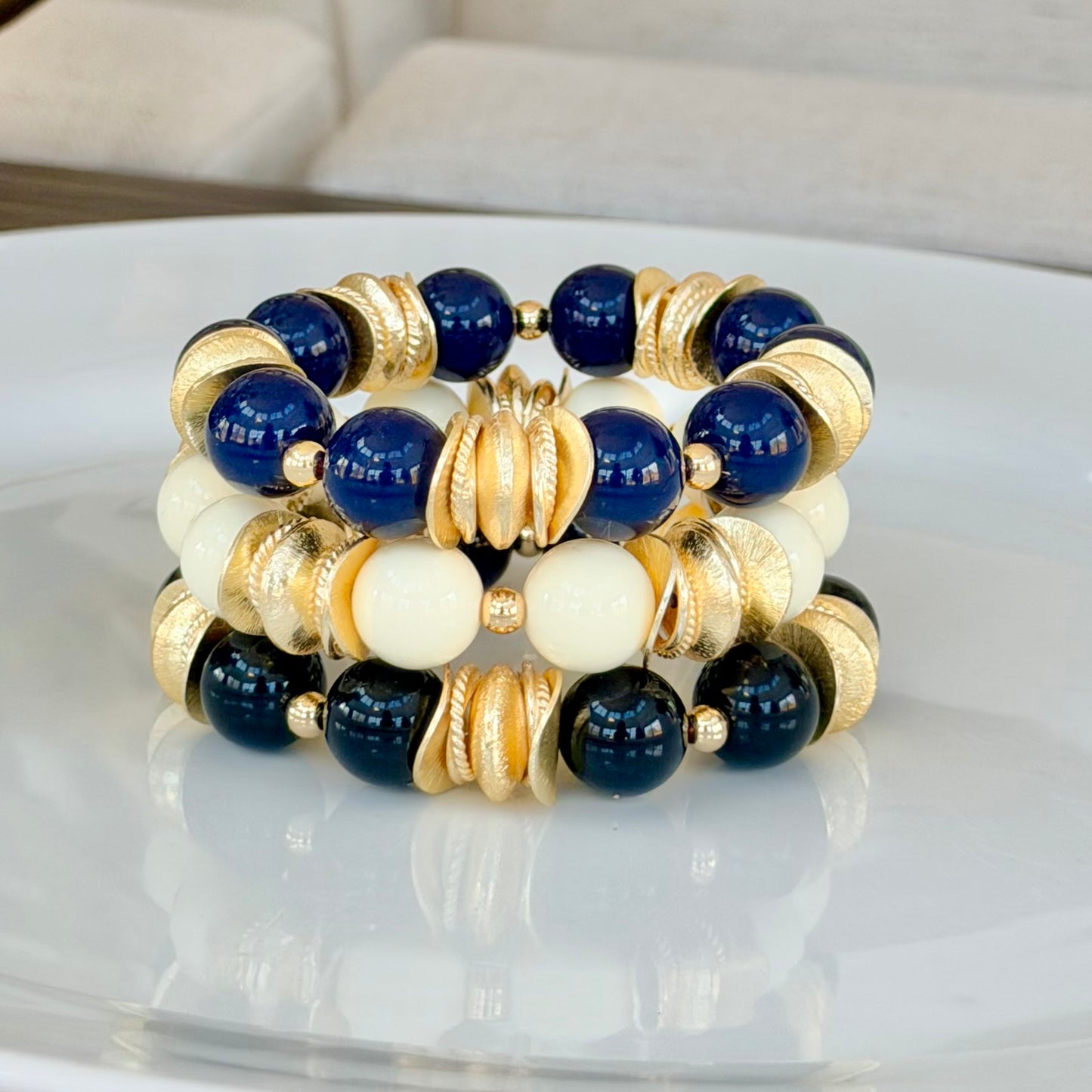 BLACK AND GOLD WAVY DISC BANGLE WITH BRUSHED GOLD ACCENTS