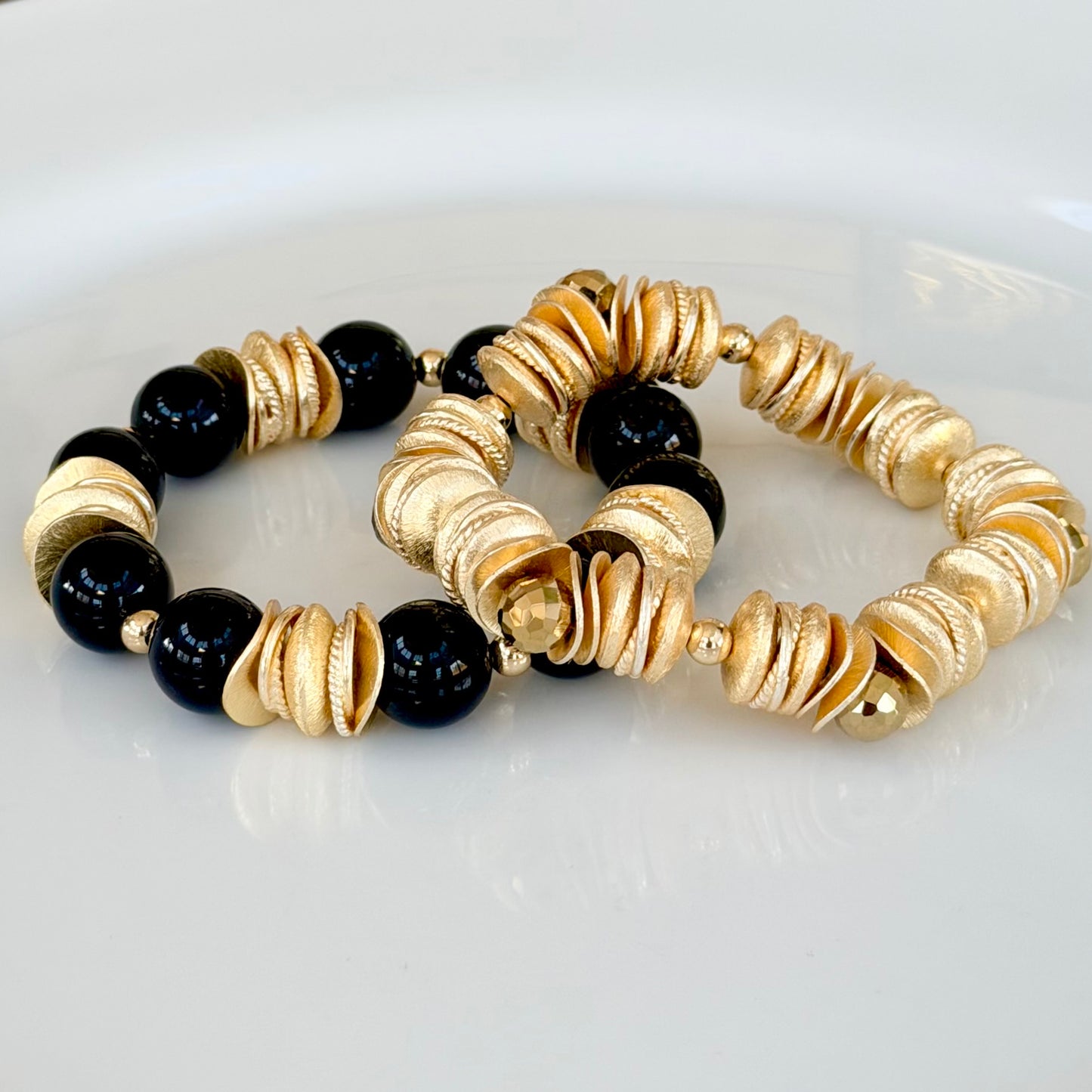 BLACK AND GOLD WAVY DISC BANGLE WITH BRUSHED GOLD ACCENTS