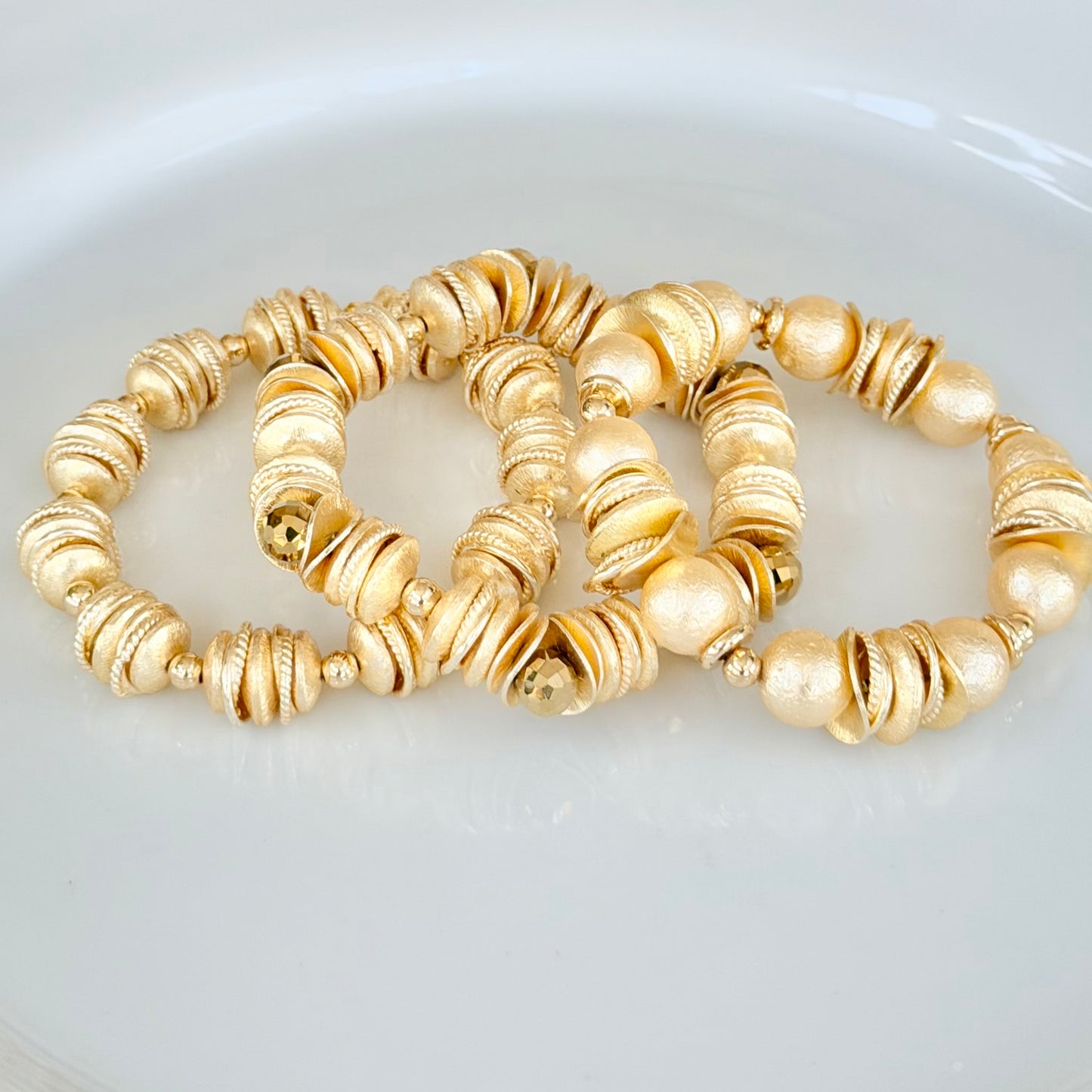 GOLD AND SHELL PEARL BANGLE WITH GOLD WAVY DISC AND GOLD ACCENTS