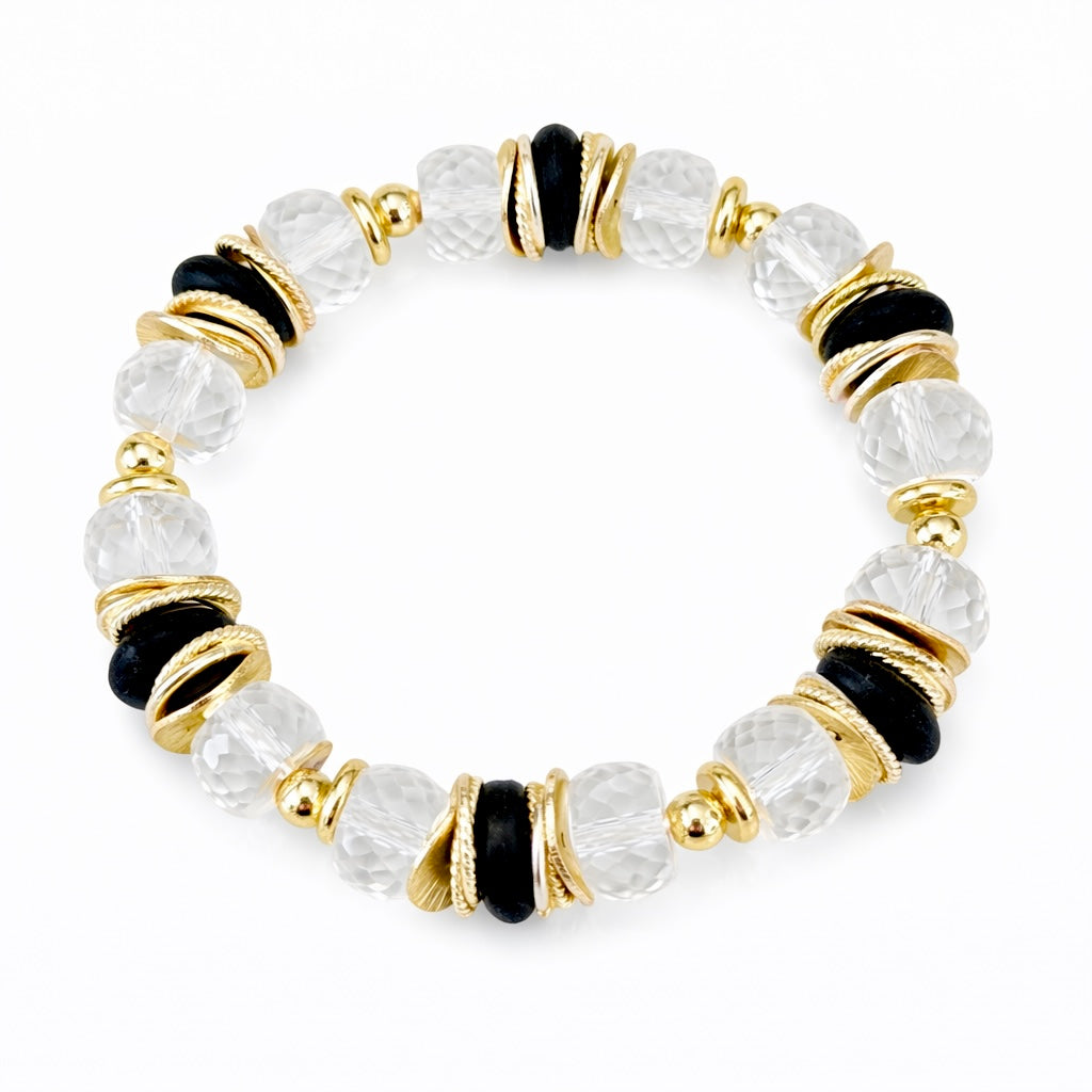 FACETED LUCITE BANGLE WITH GOLD, WAVY DISC AND BLACK ACCENTS