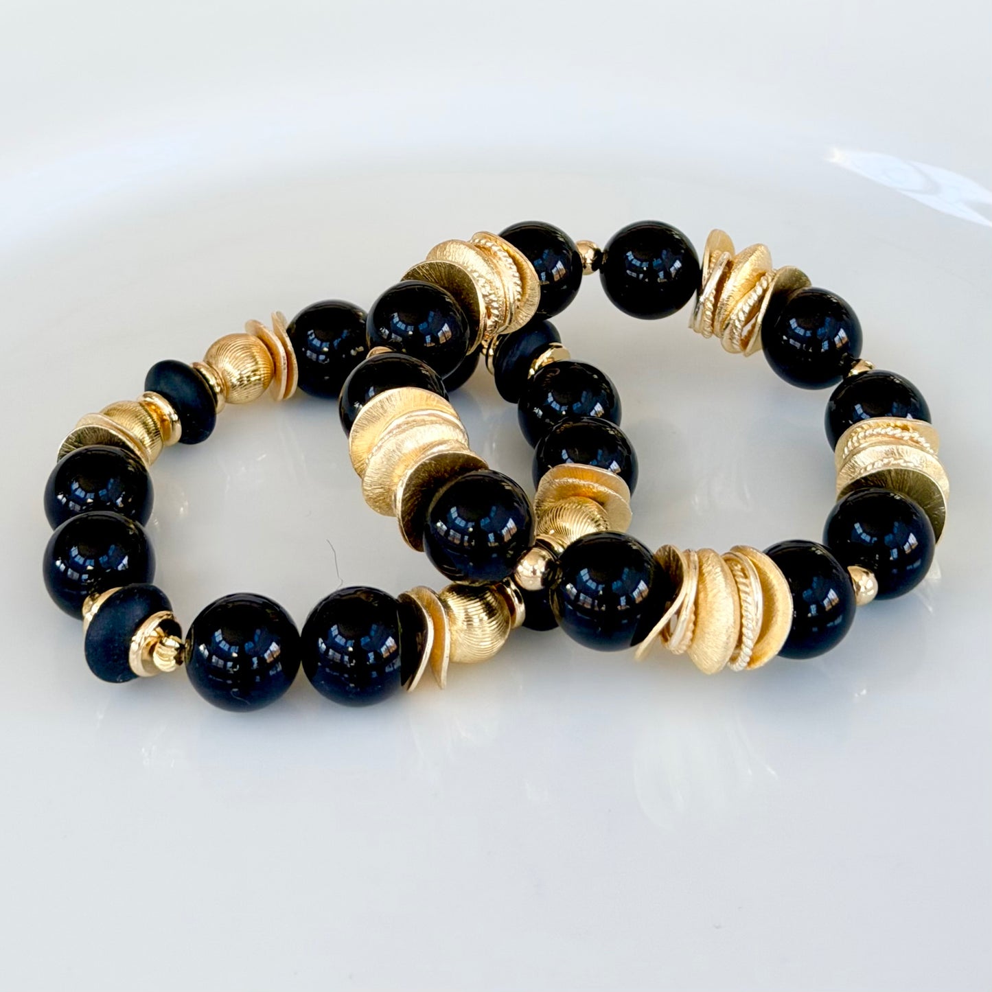 BLACK AND GOLD WAVY DISC BANGLE WITH BRUSHED GOLD ACCENTS