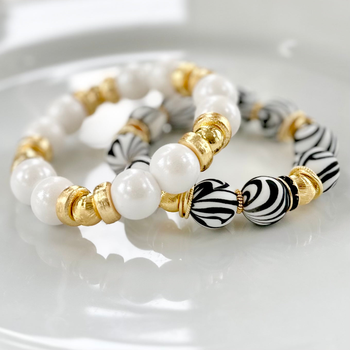 BLACK AND WHITE ZEBRA BANGLE WITH GOLD ACCENTS