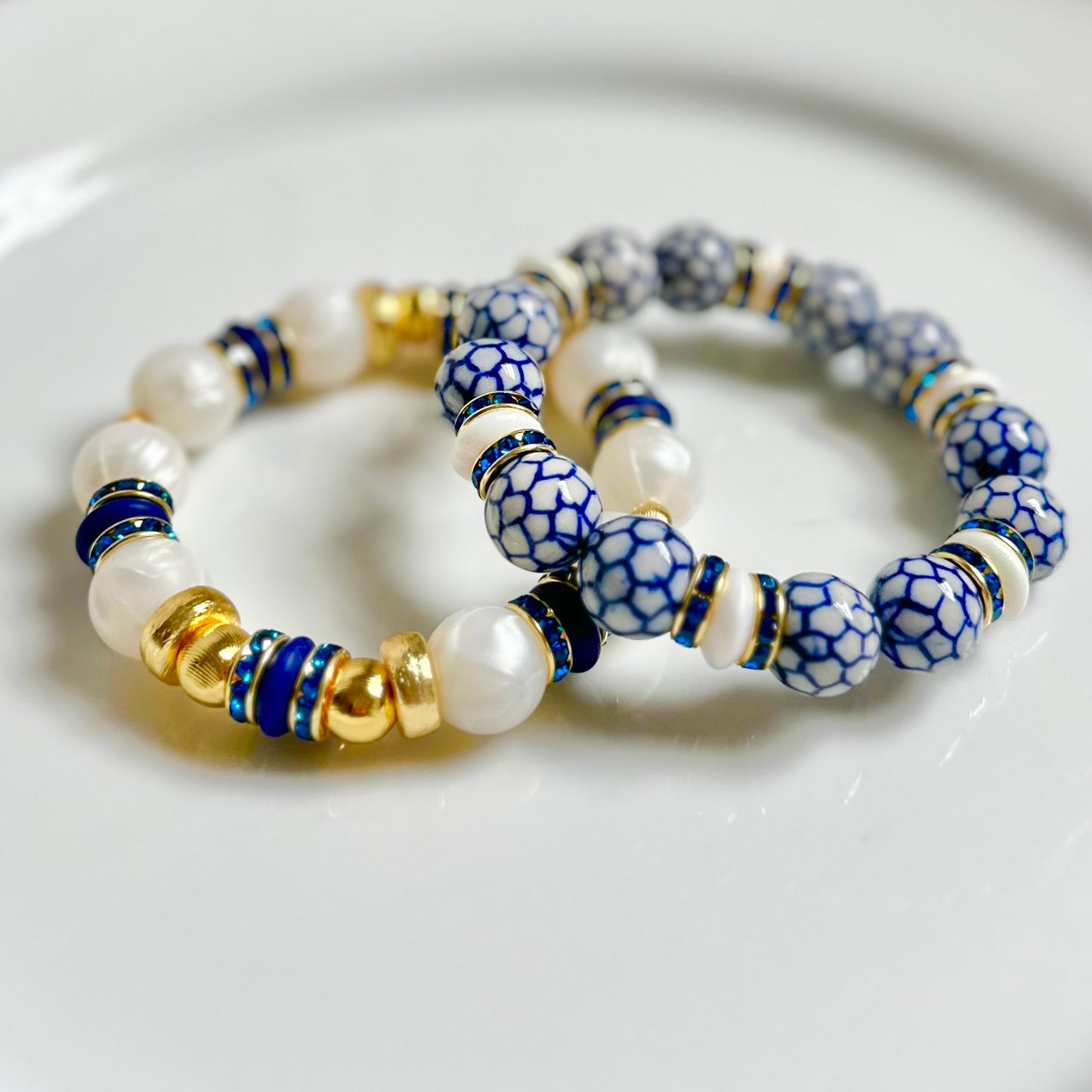PEARLIZED IVORY BANGLE WITH DARK BLUE AND CZ ACCENTS