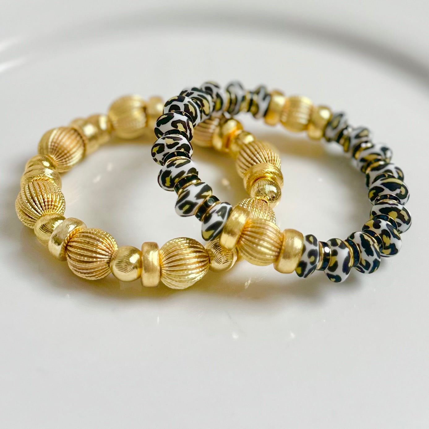 CHEETAH COIL BRACELET WITH BLACK CZ AND GOLD ACCENTS