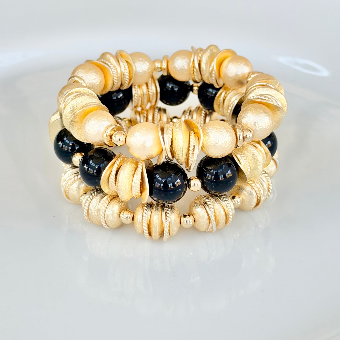 GOLD AND SHELL PEARL BANGLE WITH GOLD WAVY DISC AND GOLD ACCENTS