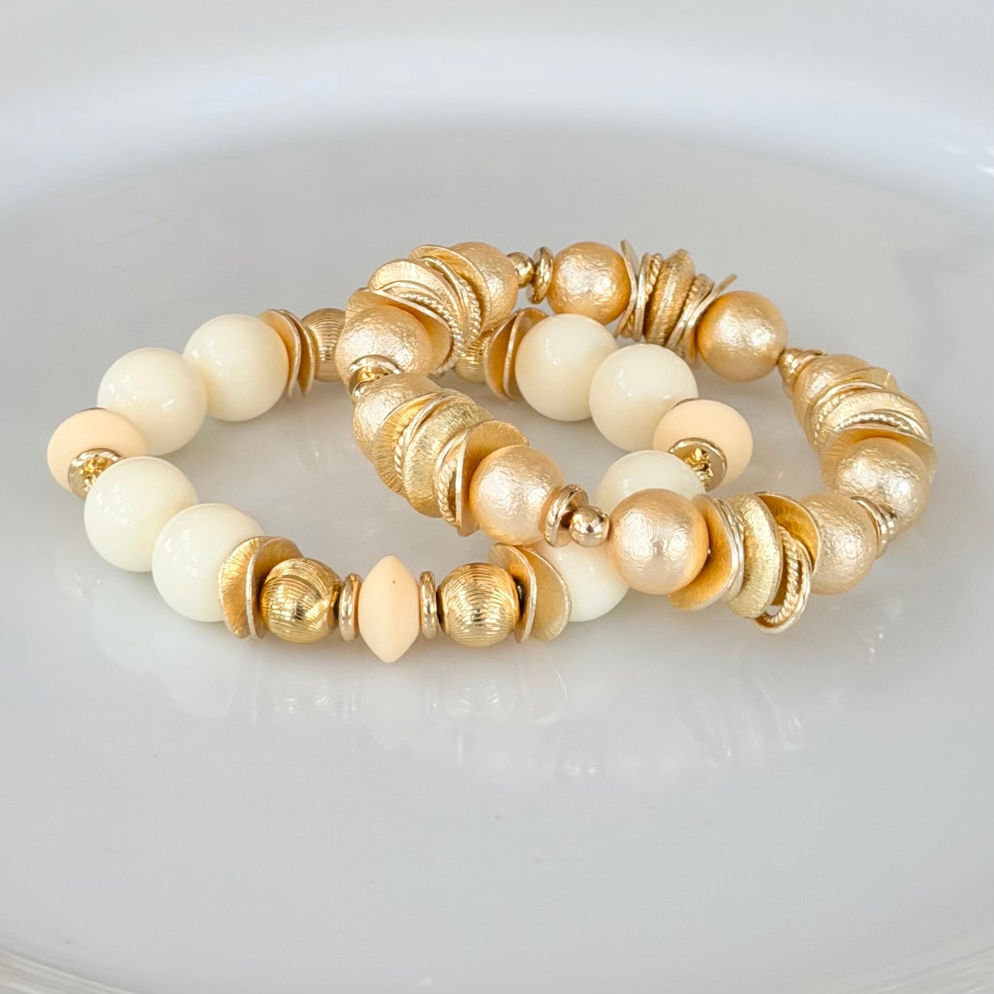 GOLD AND SHELL PEARL BANGLE WITH GOLD WAVY DISC AND GOLD ACCENTS