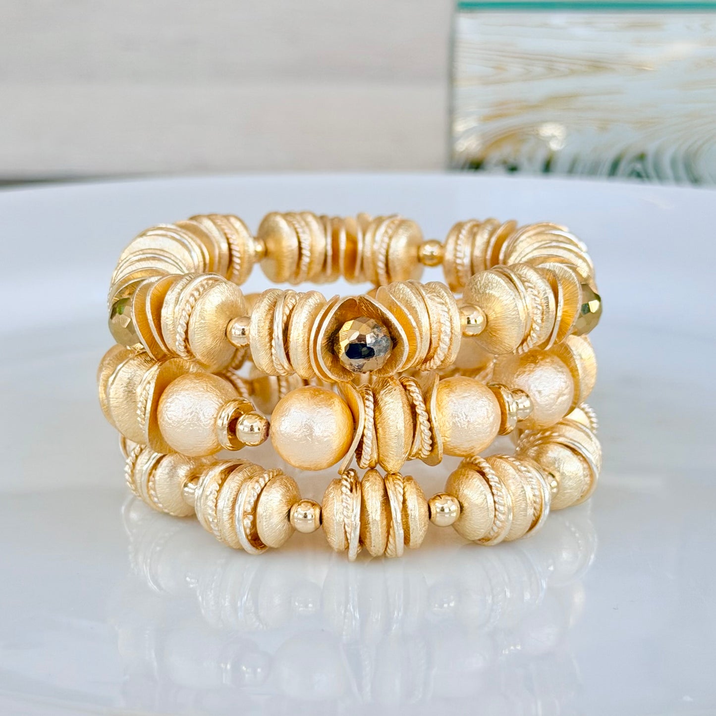 GOLD WAVY DISC BANGLE WITH FACETED GOLD BRIOLETTE ACCENTS