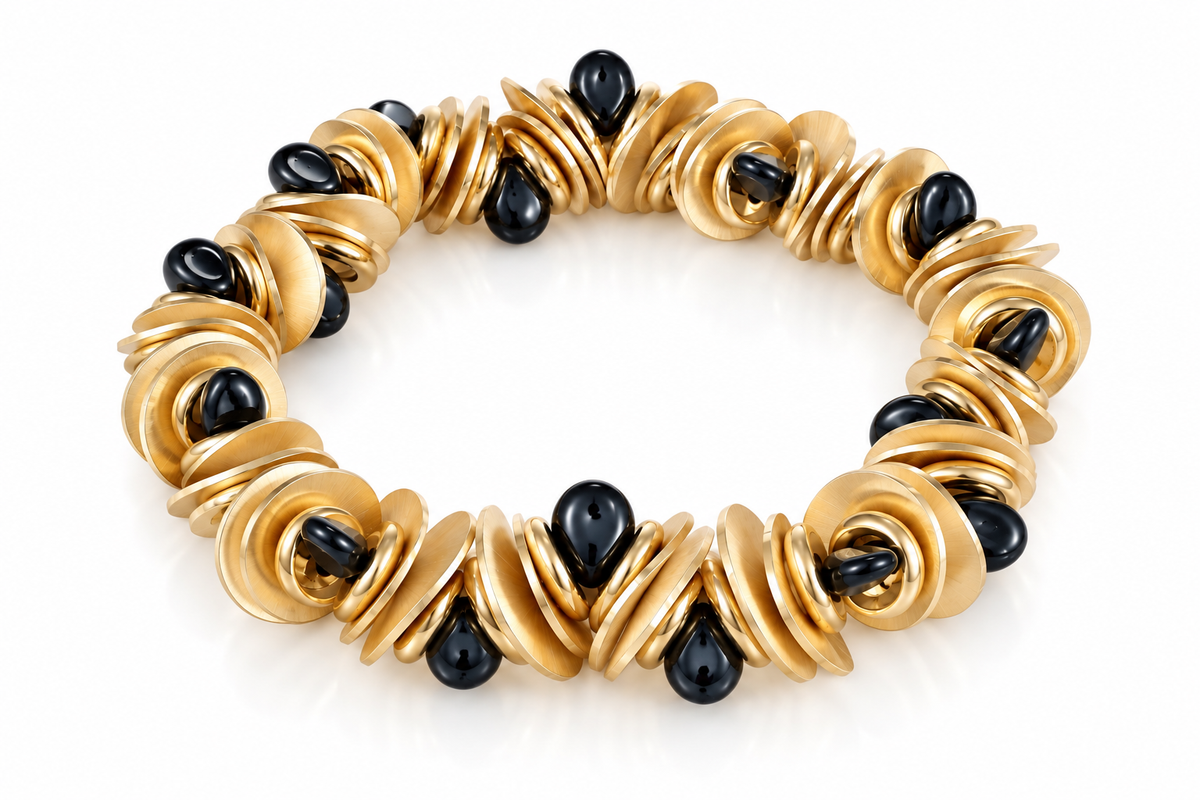 THE SOLIEL BRACELET IN GOLD AND MIDNIGHT