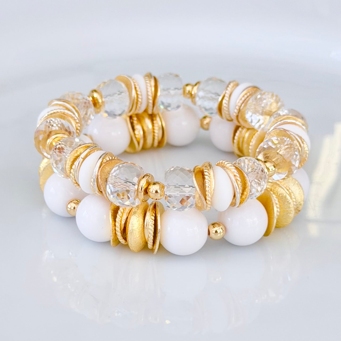 FACETED LUCITE BANGLE WITH GOLD, WAVY DISC AND WHITE ACCENTS
