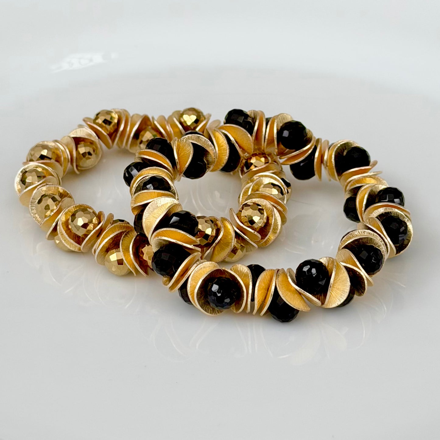 GOLD WAVY DISC AND BLACK FACETED BRIOLETTE BANGLE