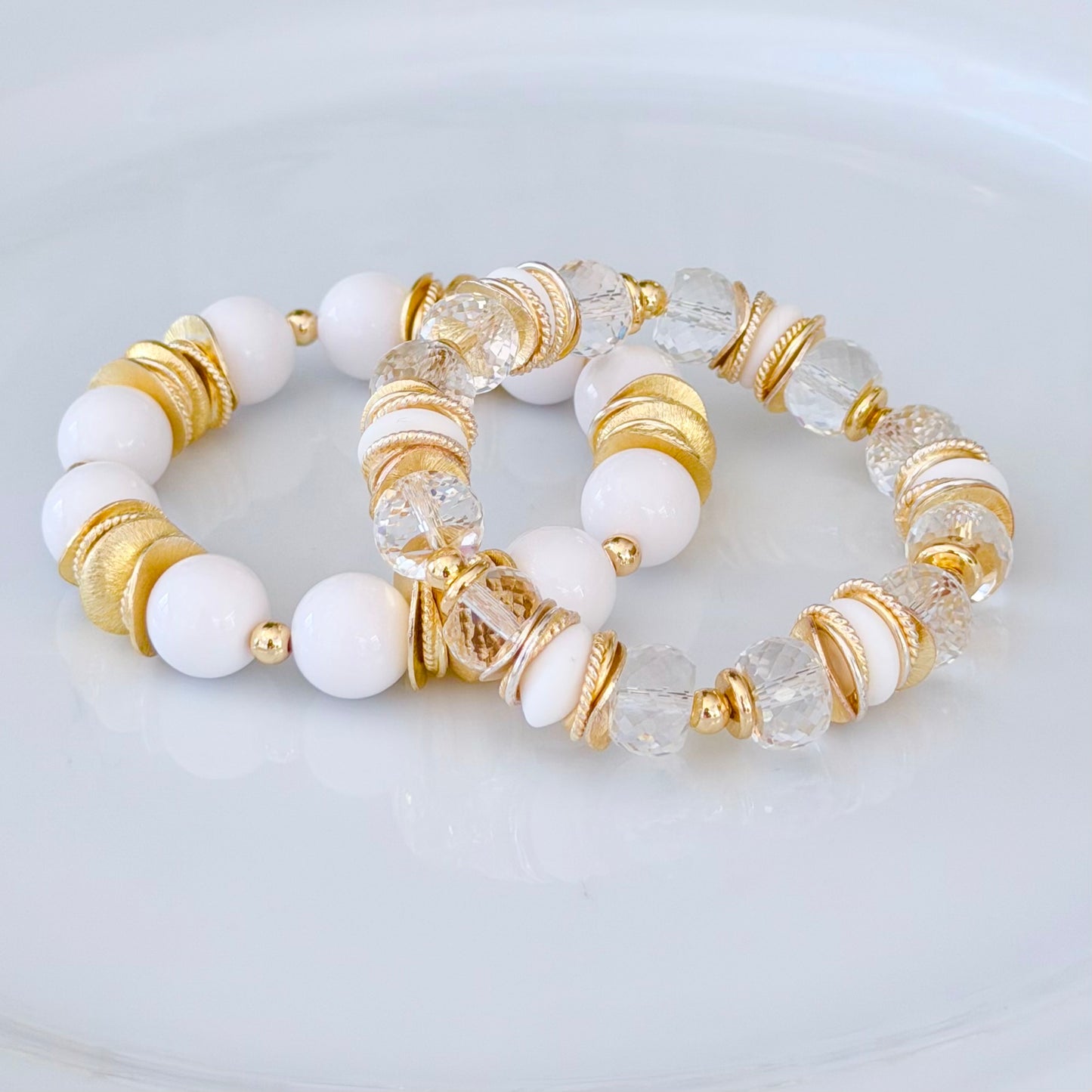 FACETED LUCITE BANGLE WITH GOLD, WAVY DISC AND WHITE ACCENTS