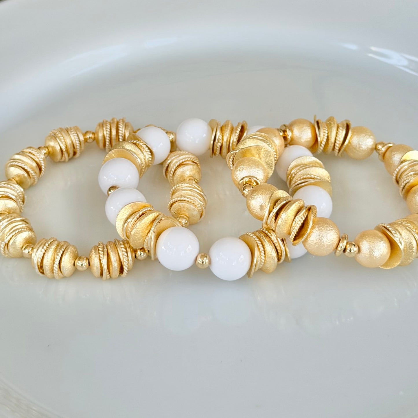 WHITE AND GOLD WAVY DISC BANGLE WITH BRUSHED GOLD ACCENTS