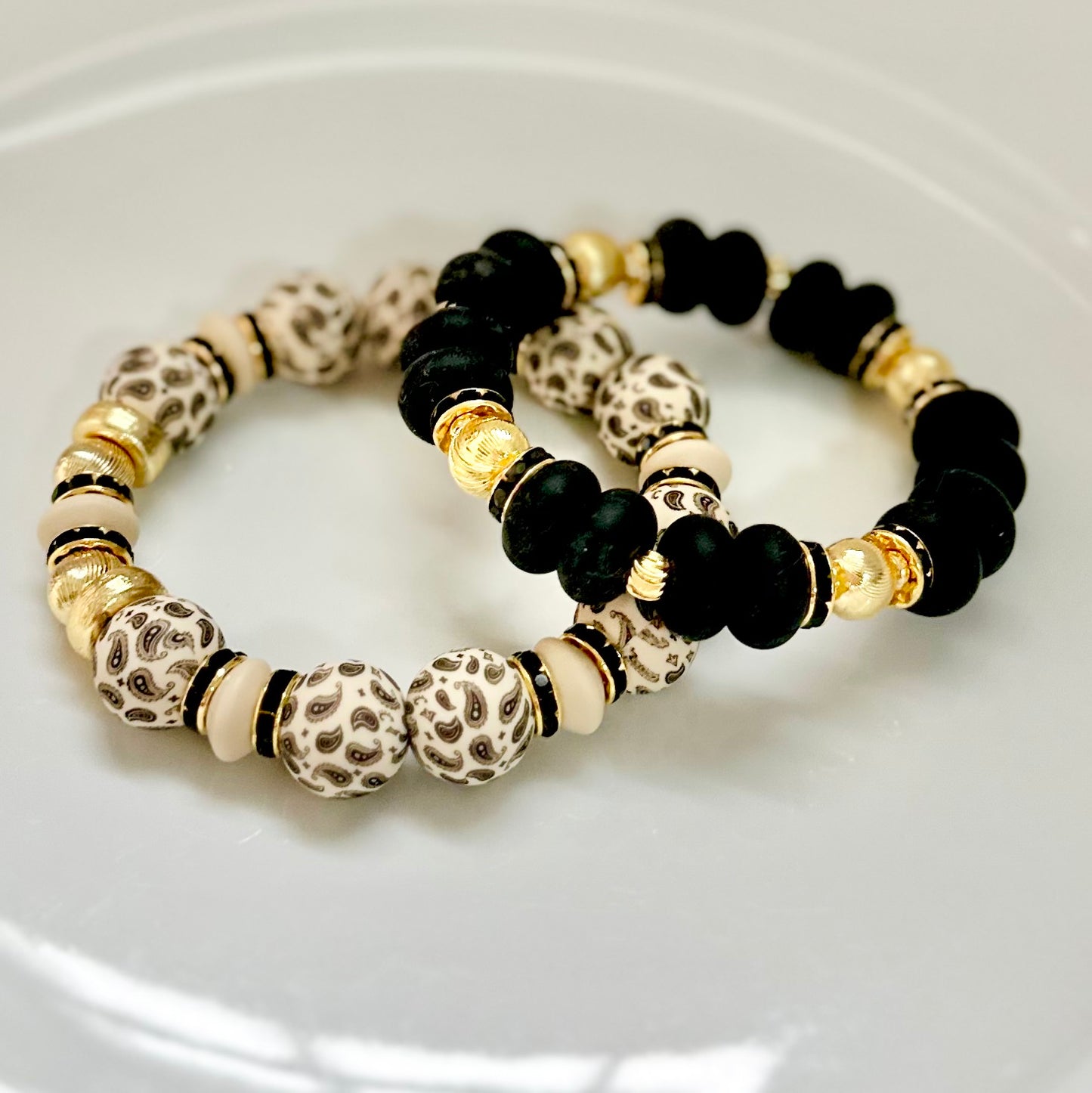 BLACK SPIRAL BANGLE WITH GOLD AND BLACK CZ ACCENTS