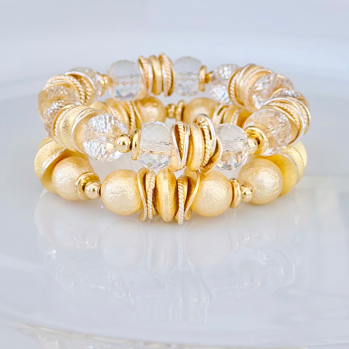 FACETED LUCITE BANGLE WITH GOLD AND WAVY DISC ACCENTS