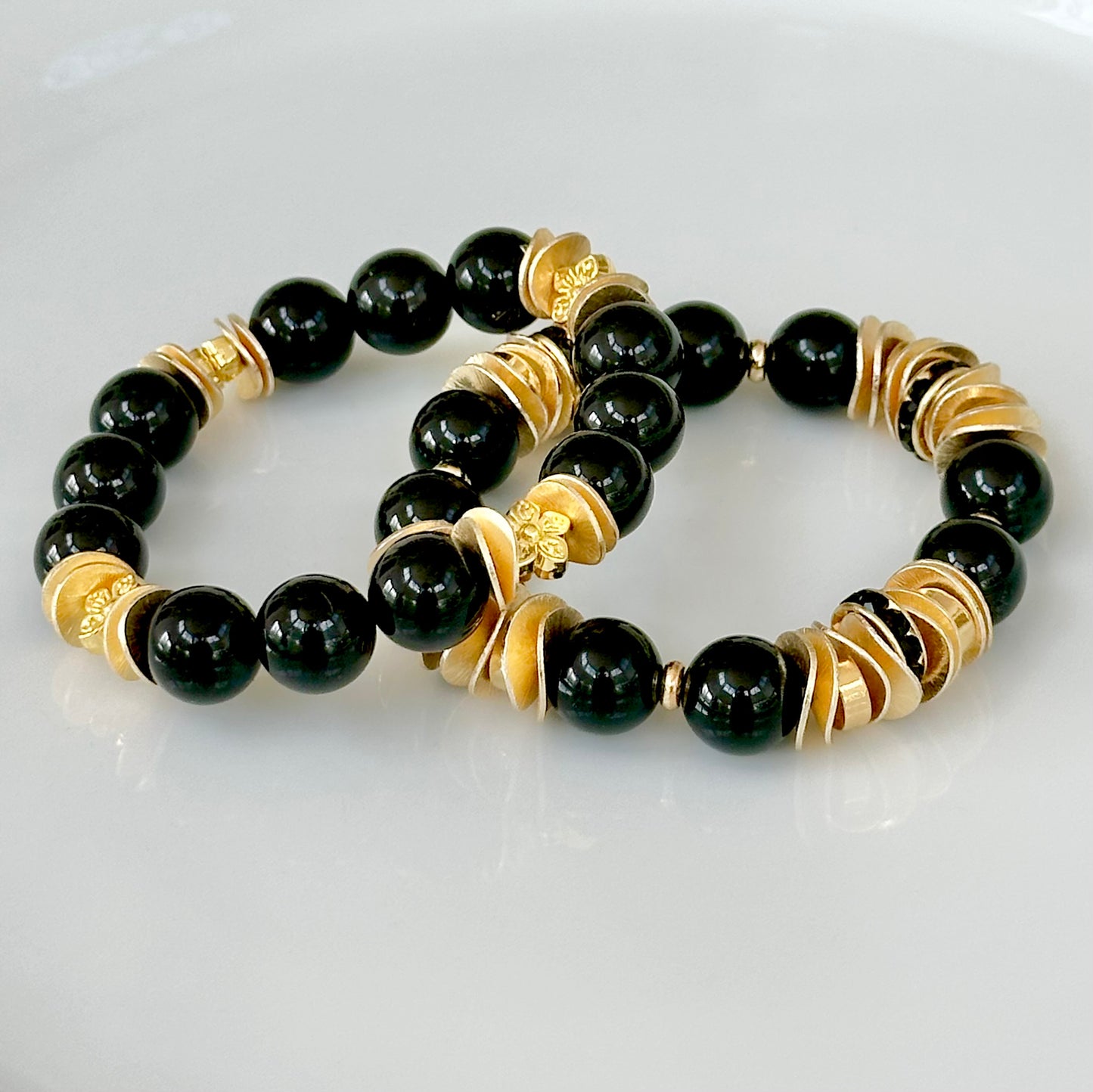 BLACK ONYX GEMSTONE BANGLE WITH GOLD WAVY DISC AND FLOWER ACCENTS