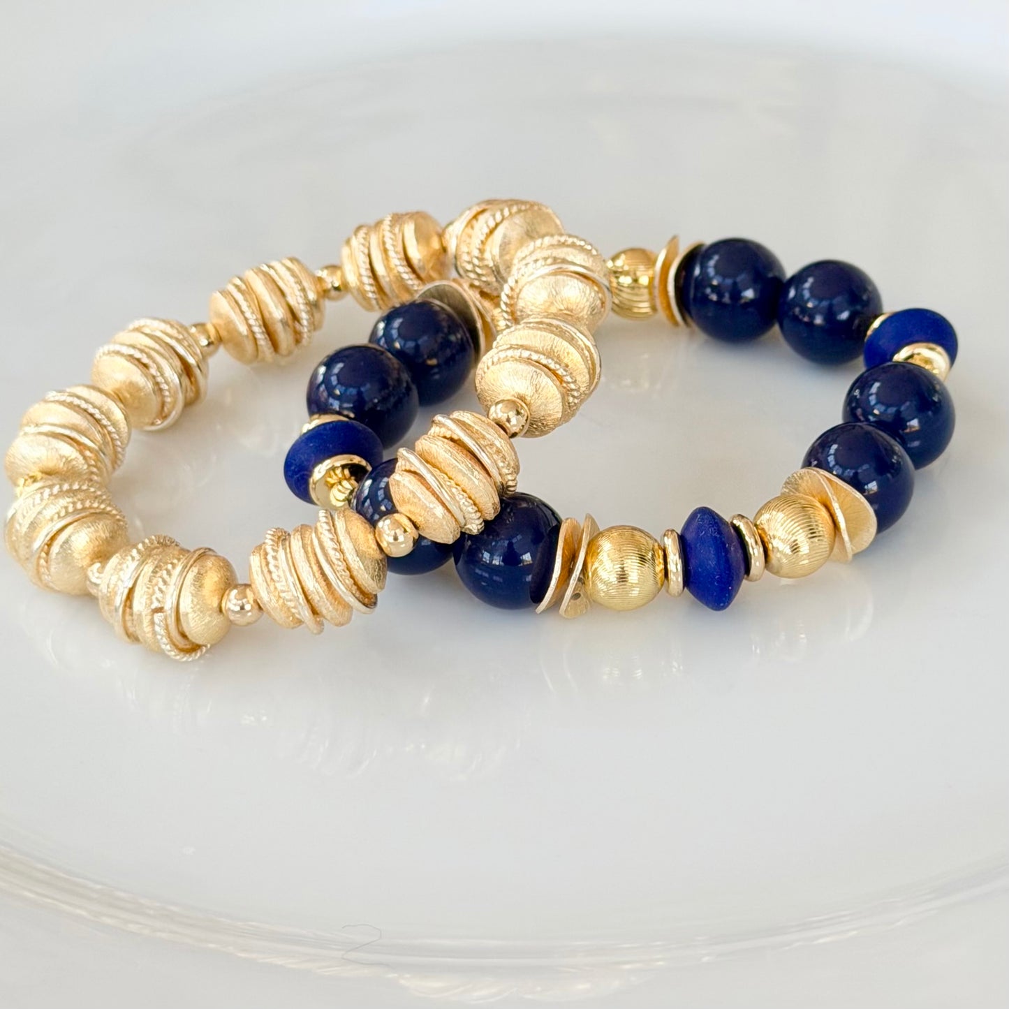 NAVY BLUE BANGLE WITH GOLD WAVY DISC AND NAVY ACCENTS