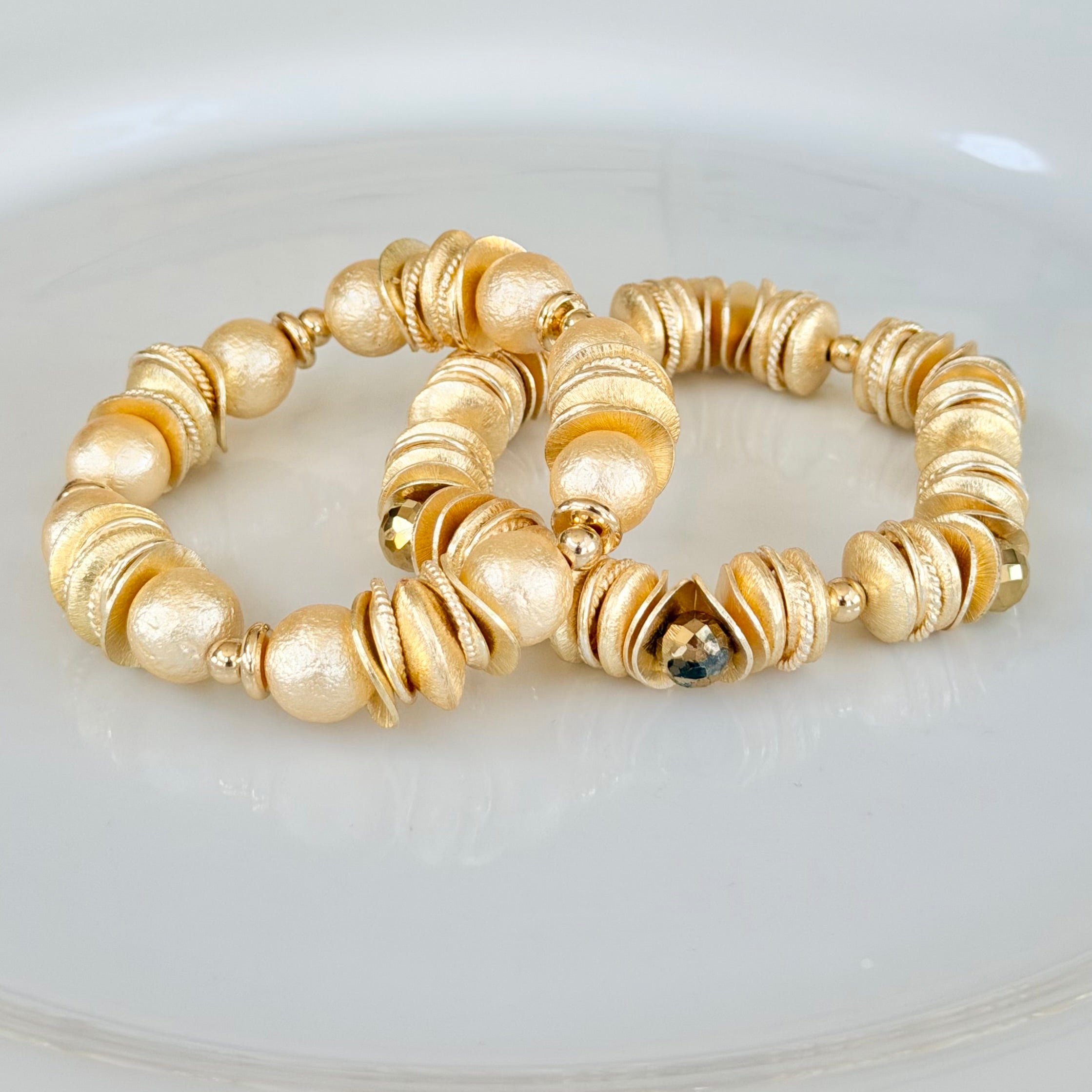GOLD AND SHELL PEARL BANGLE WITH GOLD WAVY DISC AND GOLD ACCENTS