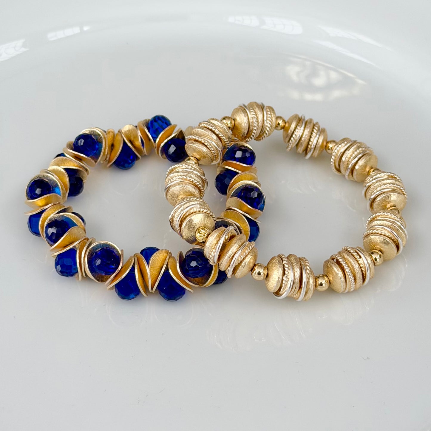 GOLD WAVY DISC AND BLUE FACETED BRIOLETTE BANGLE