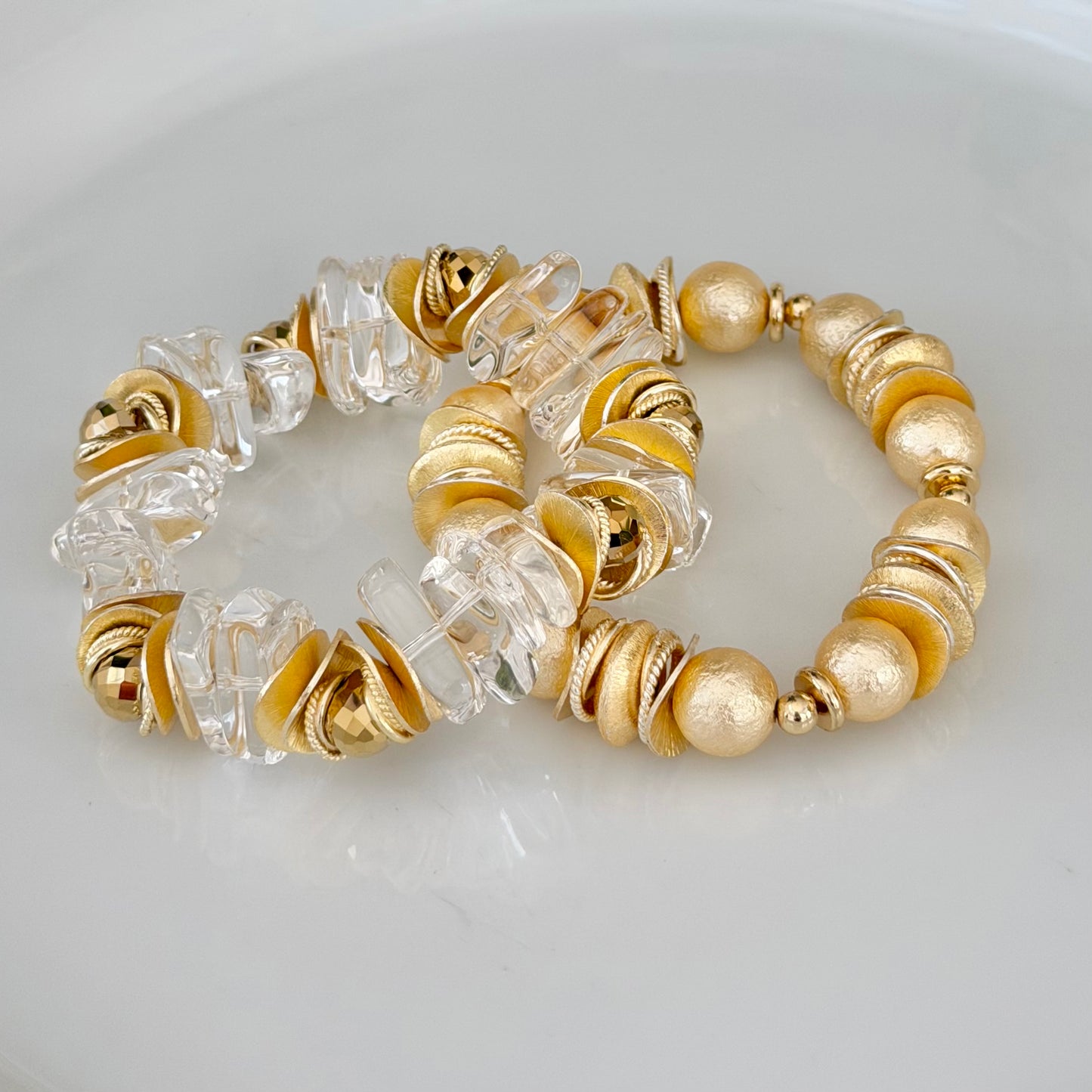 LUCITE BANGLE WITH GOLD TEARDROP AND WAVY DISC ACCENTS