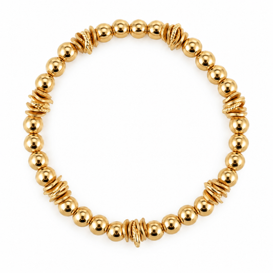 THE LIZA WRISTLET IN GOLD WITH WAVY DISC ACCENTS