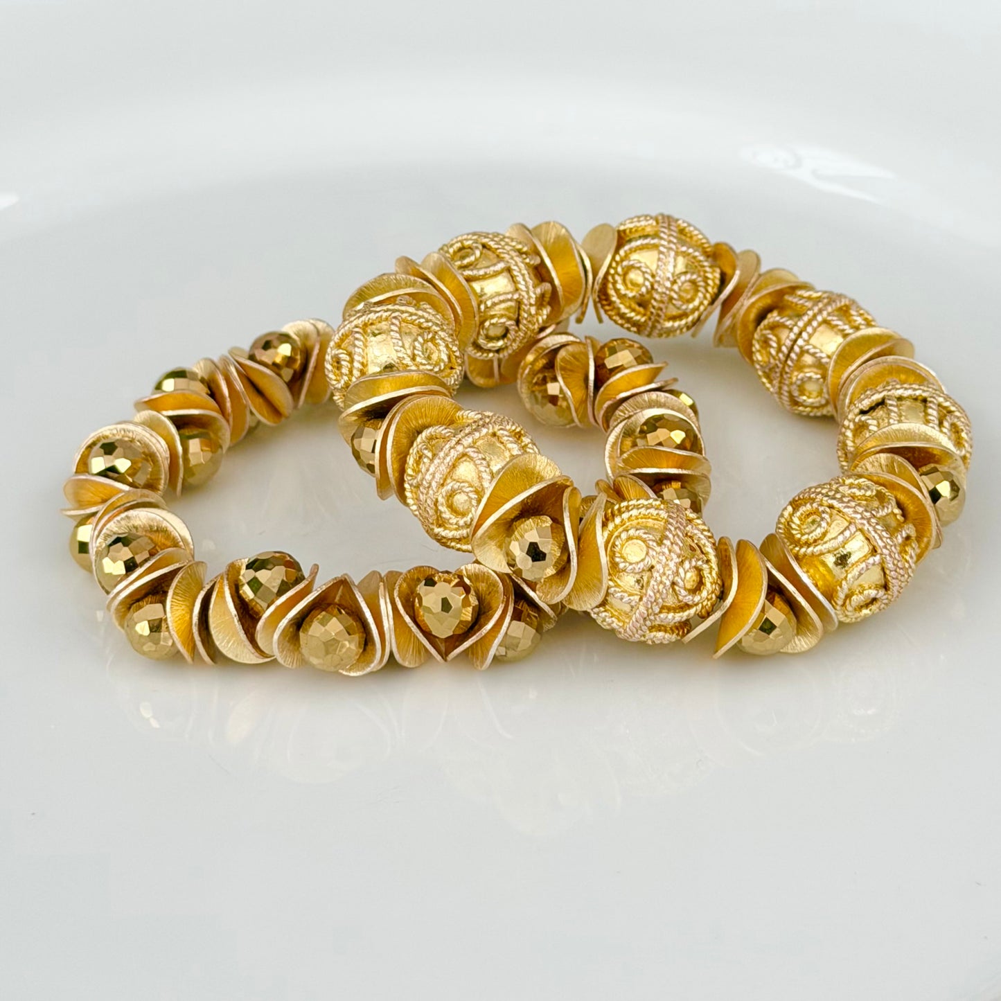 GOLD FILAGREE BANGLE WITH WAVY DISC AND FACETED GOLD BRIOLETTE ACCENTS