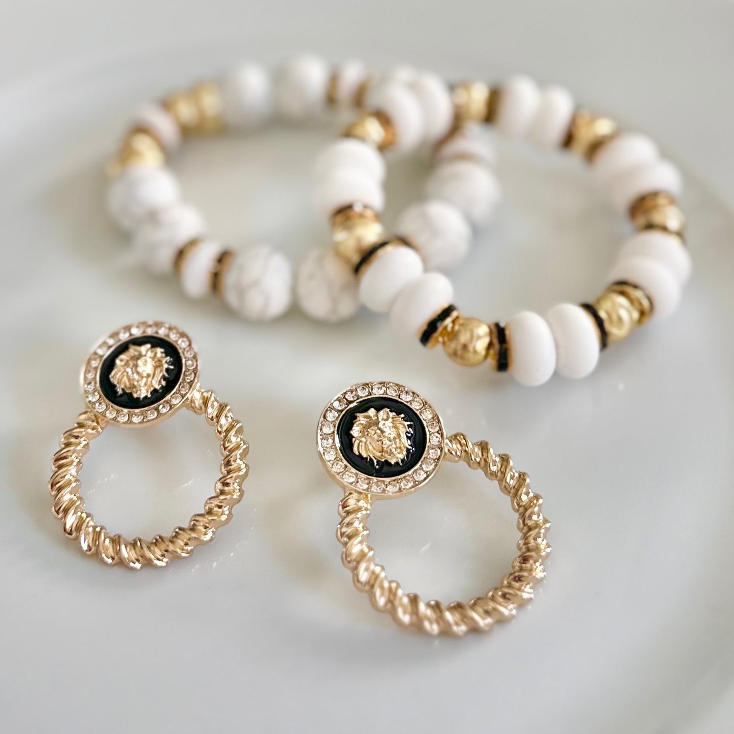 GOLD AND BLACK LION HEAD EARRING WITH CZ INLAY