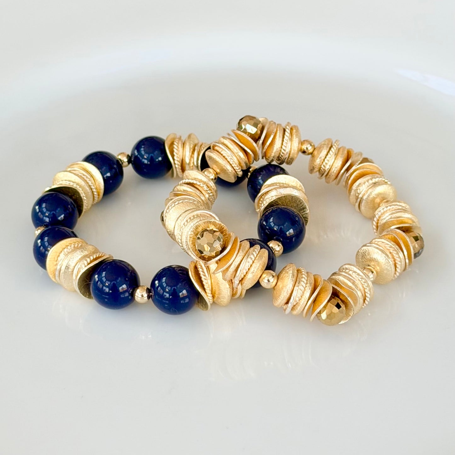 GOLD WAVY DISC BANGLE WITH FACETED GOLD BRIOLETTE ACCENTS