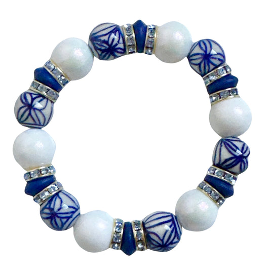 PORCELAIN AND OPALIZED WHITE BANGLE WITH WHITE AND BLUE CZ ACCENTS