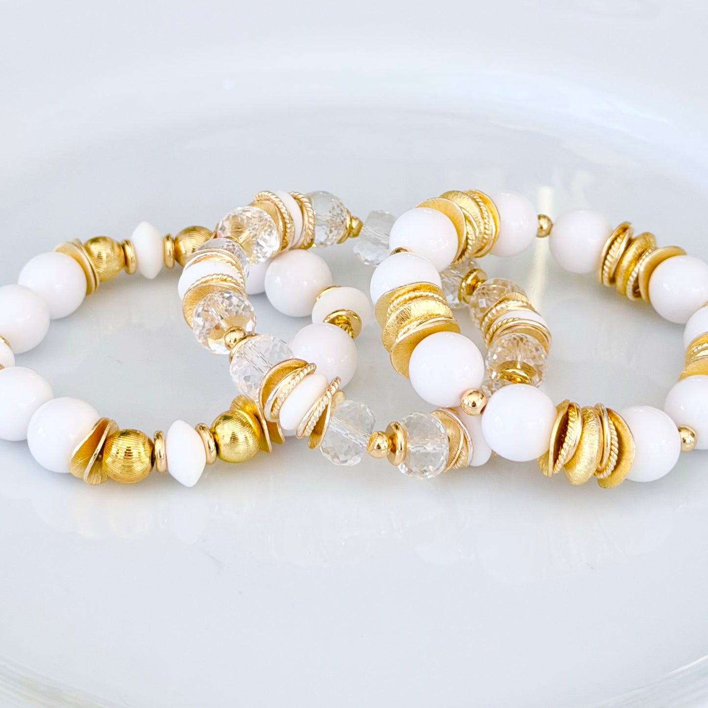 FACETED LUCITE BANGLE WITH GOLD, WAVY DISC AND WHITE ACCENTS