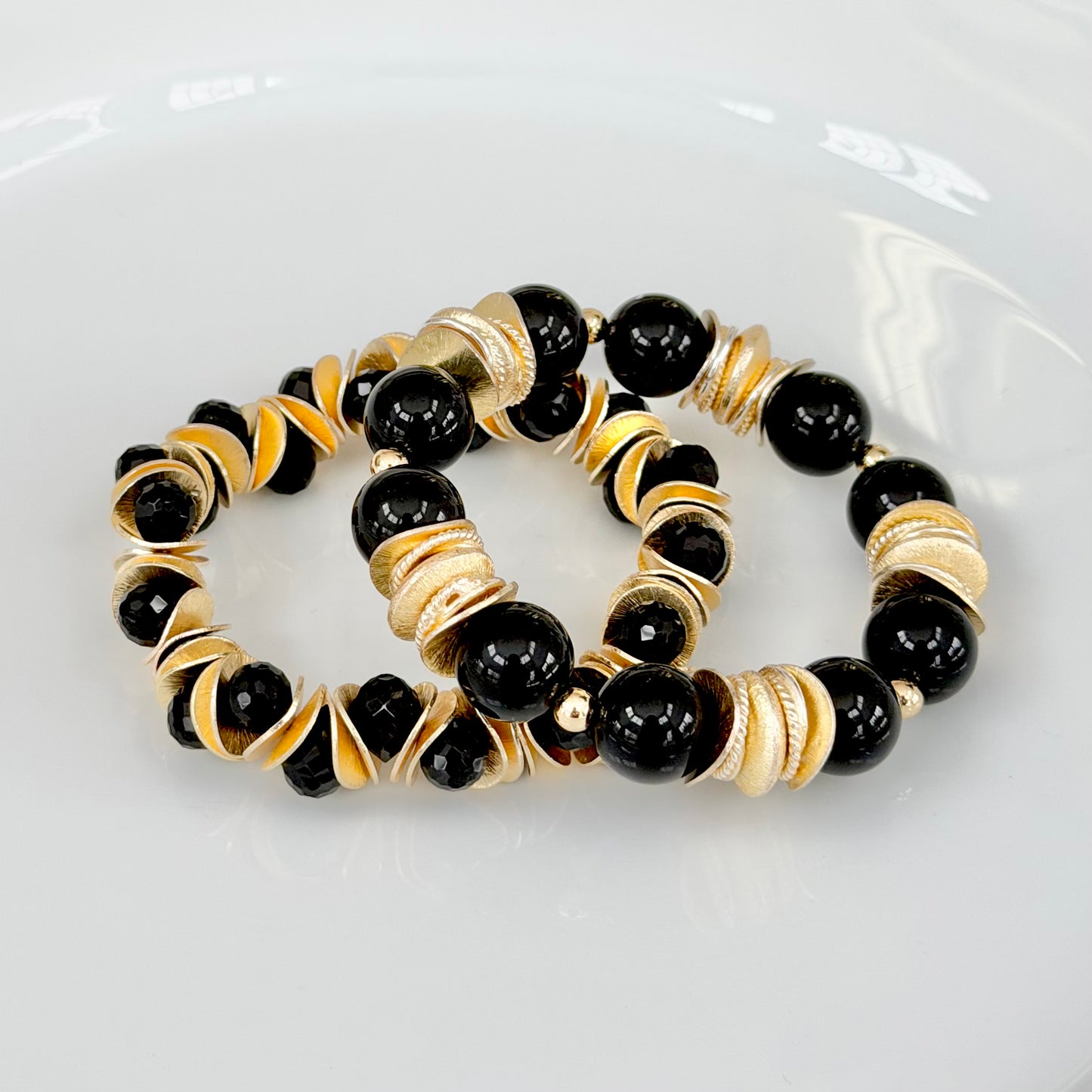 GOLD WAVY DISC AND BLACK FACETED BRIOLETTE BANGLE