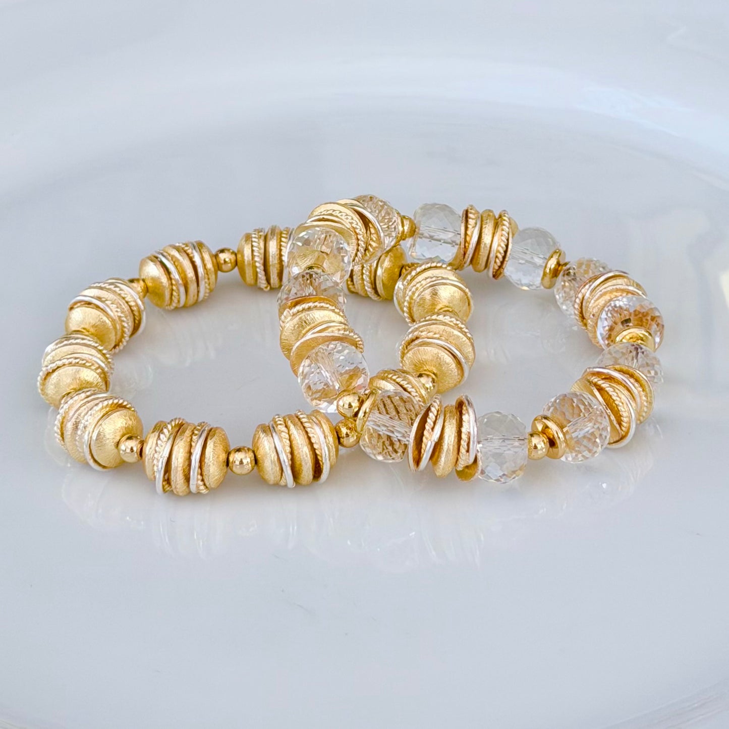 FACETED LUCITE BANGLE WITH GOLD AND WAVY DISC ACCENTS