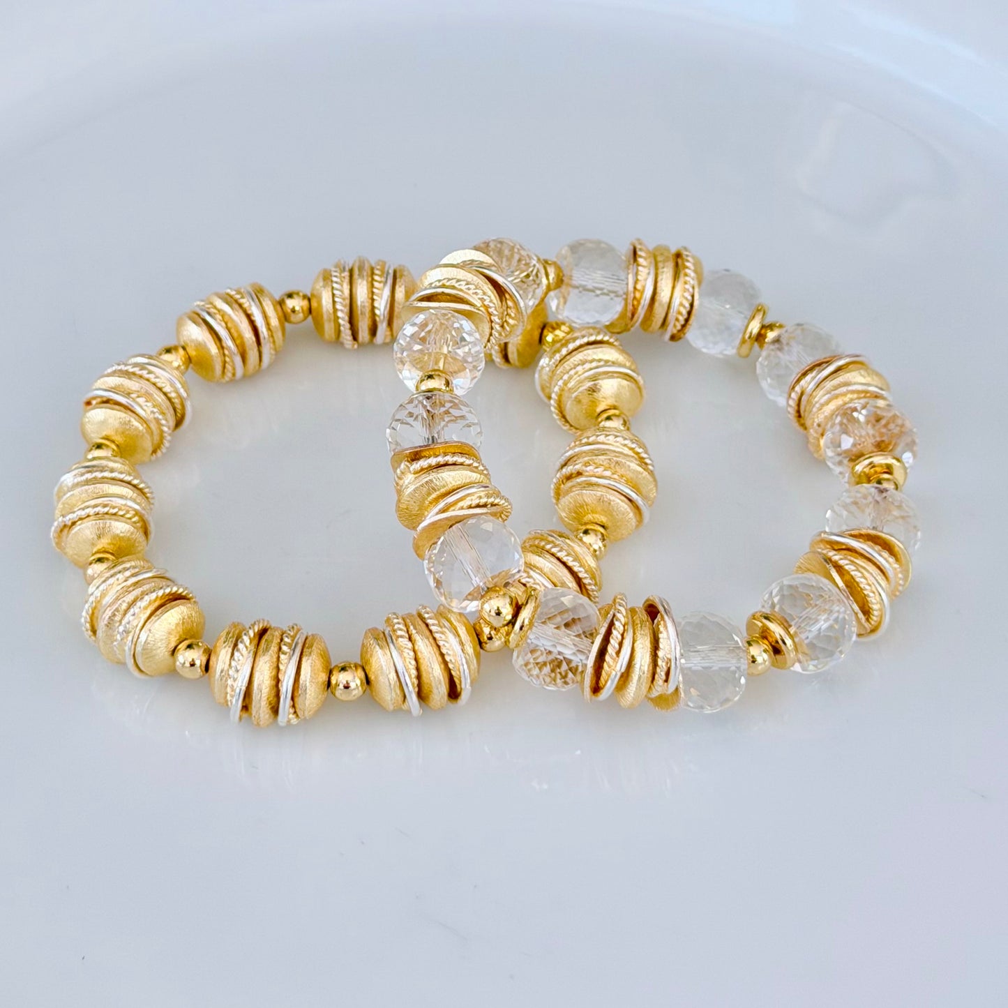 FACETED LUCITE BANGLE WITH GOLD AND WAVY DISC ACCENTS